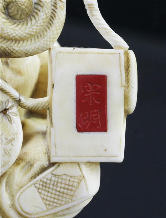 A Japanese ivory okimono of a bugaku dancer